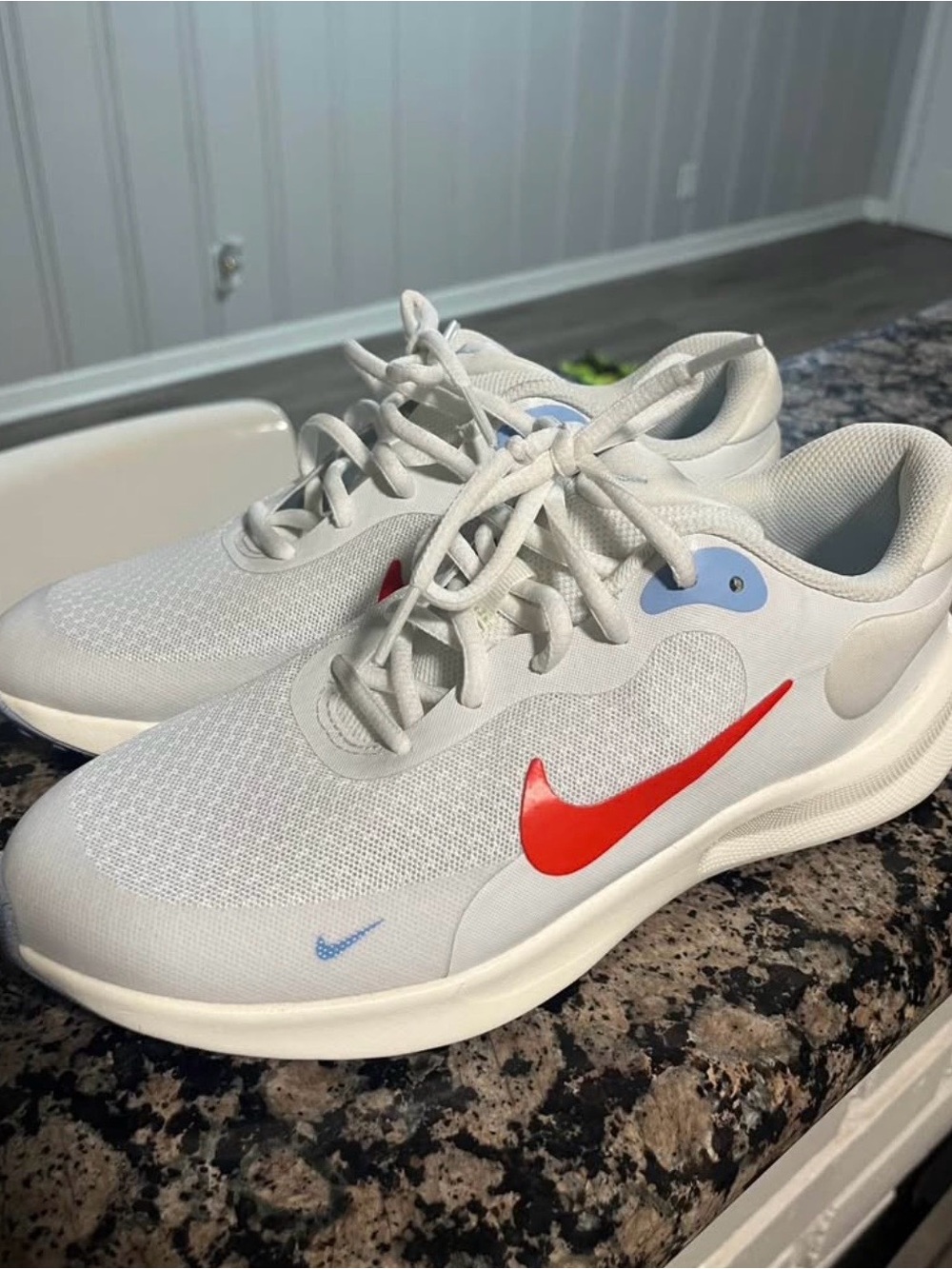 Nike Kids White Sneakers with Red Swoosh and Light Blue Accents